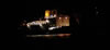 RMS St Helena with its lights shining at night
